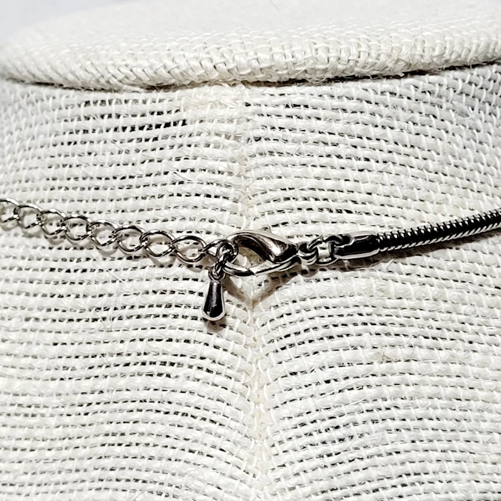Silver and Gold Tone Necklace with a Bird, Butterfly and Beads.
